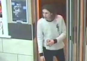 One of the men police want to speak to after a man was attacked in Ken's Fried Chicken