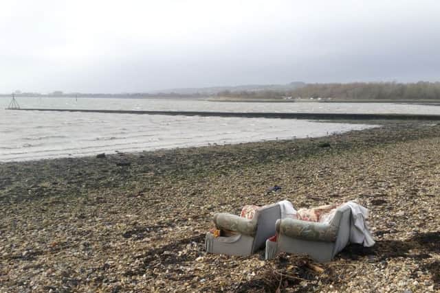Sofas dumped on the shoreline at Southmoor in Havant
Picture: Wez Smith