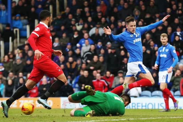 Marc McNulty is thwarted by keeper Alex Cisak Picture: Joe Pepler