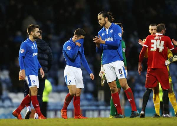 Pompey players can't hide their disappointment at the final whistle. Picture: Joe Pepler
