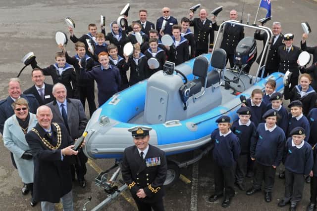 The Mayor of Fareham Councillor Mike Ford with his wife Anne Ford, christen the new Rib, watched by Commanding Officer Lt Tony Thurgood and the Warsash Sea Cadets.
Picture Ian Hargreaves (160174-1)