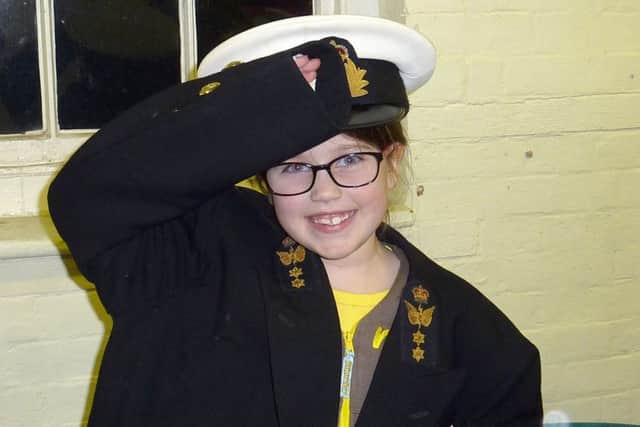 Molly Perkins dressed up in uniform