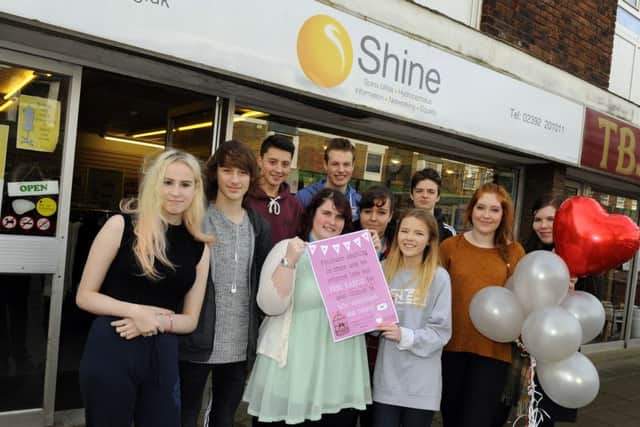 HELPING HANDS Students at Fareham College gave the Shine charity shop a makeover last week