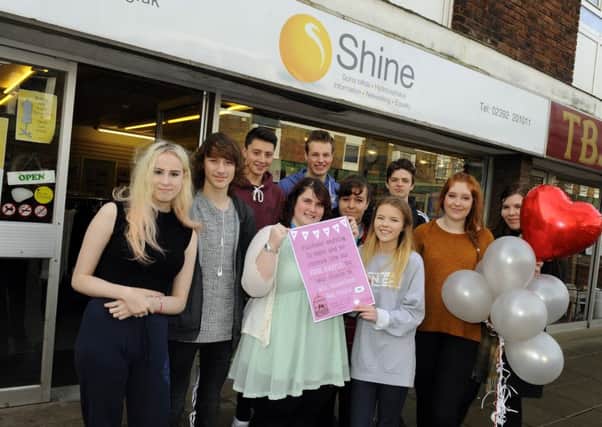 HELPING HANDS Students at Fareham College gave the Shine charity shop a makeover last week