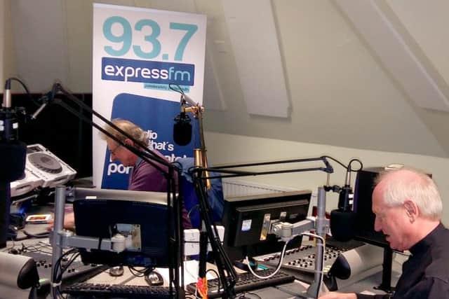 Father Mike Sheffield during his interview at Express FM with presenter Terry Powell.