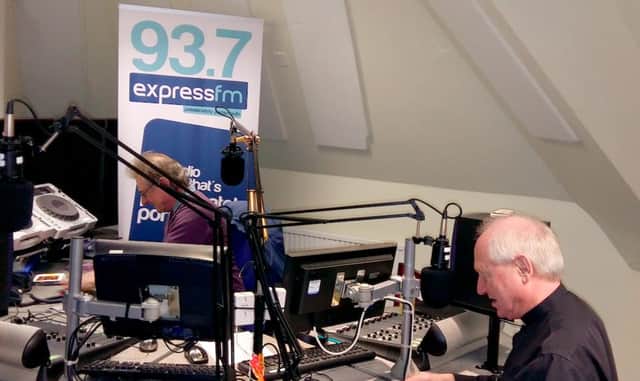 Father Mike Sheffield during his interview at Express FM with presenter Terry Powell.