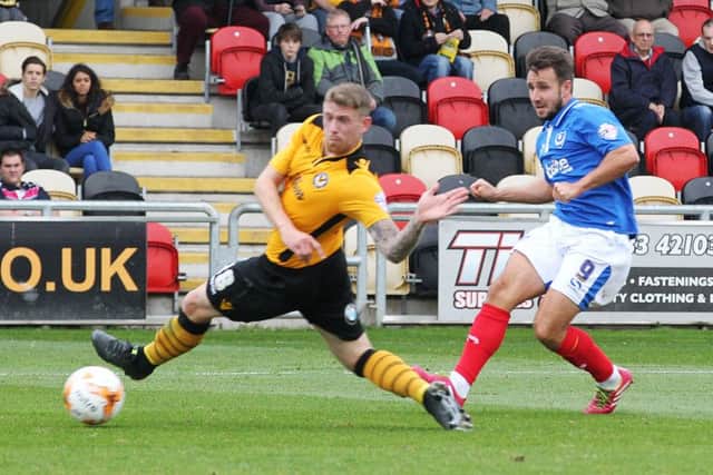 Matt Tubbs on his way to a hat-trick against Cambridge last season Picture: Joe Pepler