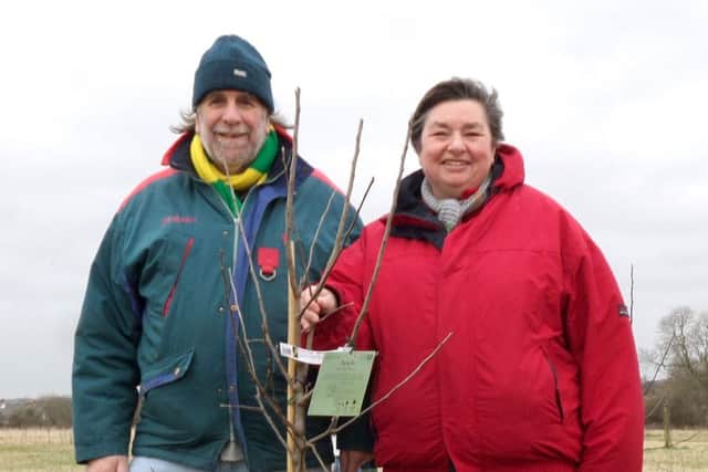 Richard Hitchcock of Greening Westbourne and Rachel Shreeve with one of her family's memorial trees