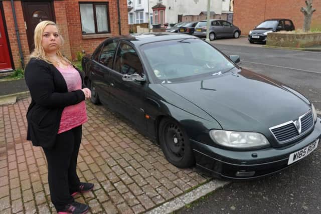 Emma Hadenham with the abandoned car