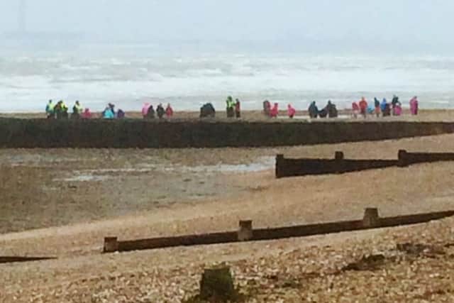 Schoolchildren on the beach at Hill Head during Storm Imogen
