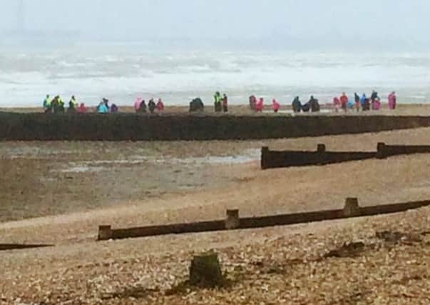 Schoolchildren on the beach at Hill Head during Storm Imogen