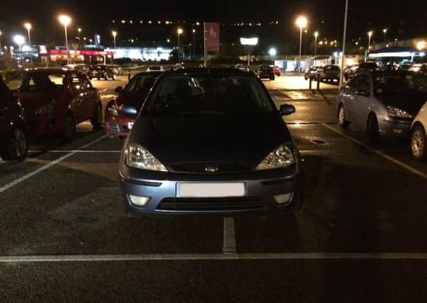 A car stradding two spaces at Tesco on North Harbour, Portsmouth