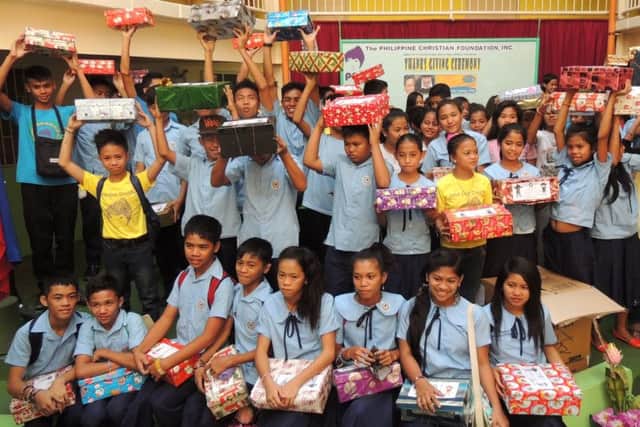 JOY Children from a school in Manila receiving their gift boxes