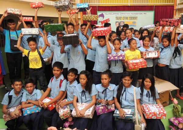 JOY Children from a school in Manila receiving their gift boxes