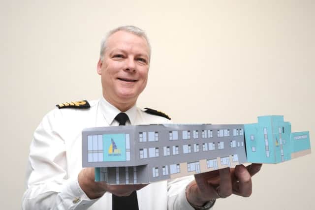 Capt Andy Cree at HMS Nelson, who is leading the development of a University Training College in Portsmouth, with a model of the building
Picture: Paul Jacobs (160013-12)