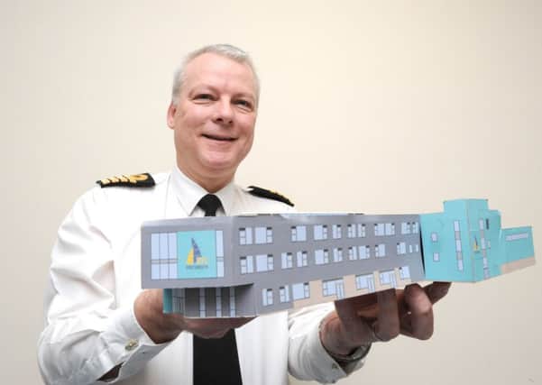 Capt Andy Cree at HMS Nelson, who is leading the development of a University Training College in Portsmouth, with a model of the building
Picture: Paul Jacobs (160013-12)