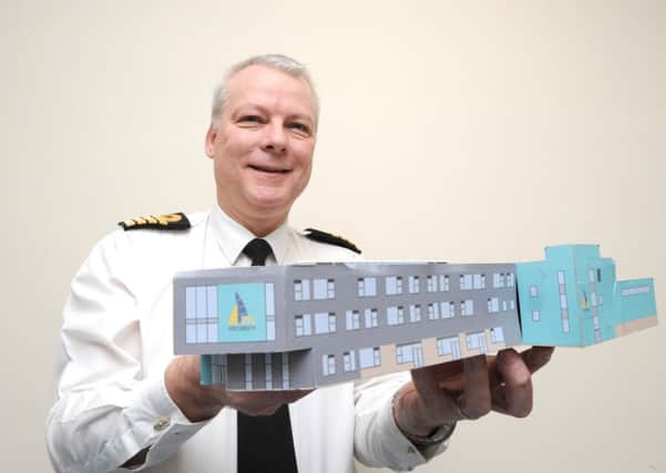 Capt Andy Cree at HMS Nelson, who is leading the development of a University Training College in Portsmouth, with a model of the building

Picture: Paul Jacobs (160013-12)