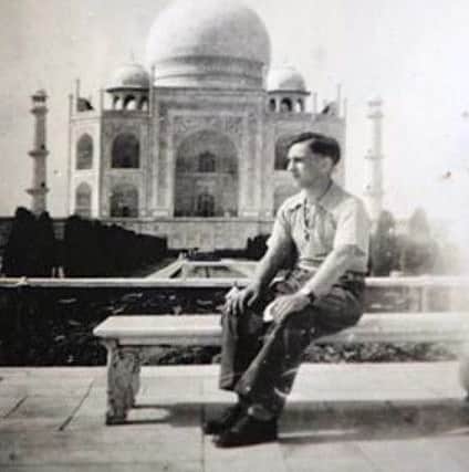 James 'Wee Jimmy' Rice, Army Corps of Signals, poses in front of the Taj Mahal, India, in 1946