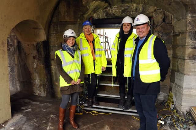 Work on The Artches beneath The Hot Walls at Old Portsmouth - from left,  Lucy Branson, Cllr. Linda Symes, project manager Bev Lucas, and Bill Branson Picture: Malcolm Wells (160212-8129)