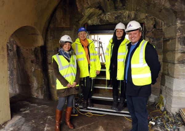 Work on The Artches beneath The Hot Walls at Old Portsmouth - from left,  Lucy Branson, Cllr. Linda Symes, project manager Bev Lucas, and Bill Branson 

Picture: Malcolm Wells (160212-8129)