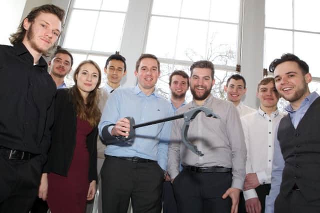 Team Portsmouth, apprentices from BAE Systems, celebrate winning a national award for their innovative 'grabber design' created to help injured soldiers