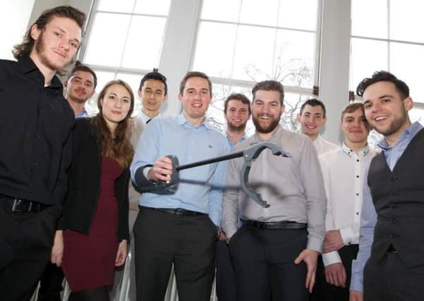 Team Portsmouth, apprentices from BAE Systems, celebrate winning a national award for their innovative 'grabber design' created to help injured soldiers