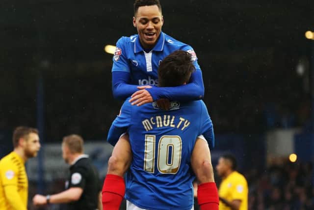 Kyle Bennett congratulates Marc McNulty for his goal Picture: Joe Pepler