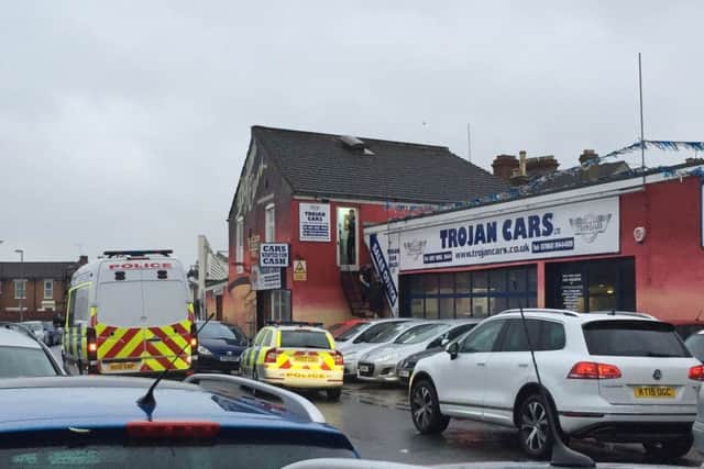 Police at Trojan Cars in Southsea on Saturday