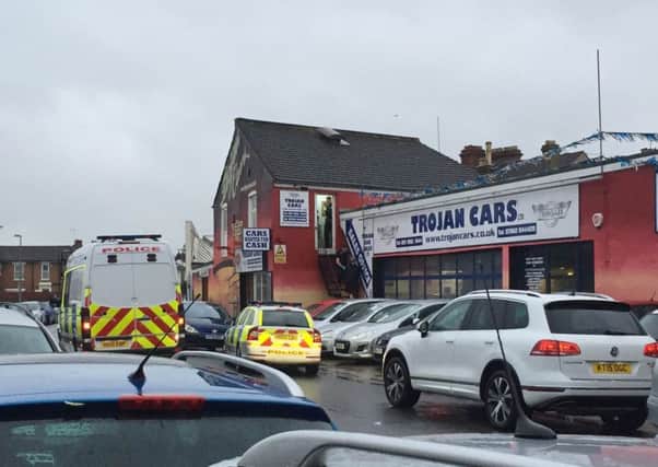 Police at Trojan Cars in Southsea on Saturday