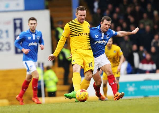 Michael Doyle battles for the ball against Bristol Rovers. Picture: Joe Pepler