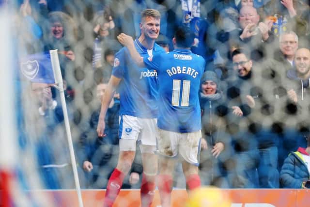 Michael Smith celebrates after showing Pompey fans what he can do. Picture: Joe Pepler