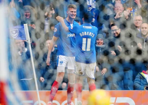 Michael Smith celebrates after showing Pompey fans what he can do. Picture: Joe Pepler