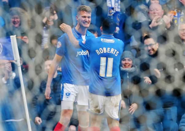Michael Smith celebrates his maiden goal for Pompey with Gary Roberts Picture: Joe Pepler