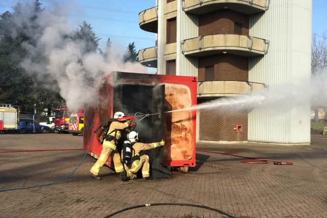 Watch managers Tim Gray and Rob Jenks demonstrate the new high-pressure lance to be brought in as part of changes to Hampshire Fire and Rescue Service