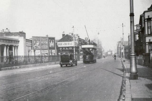 A tram passes Mile End cemetery, Portsmouth, between the wars.