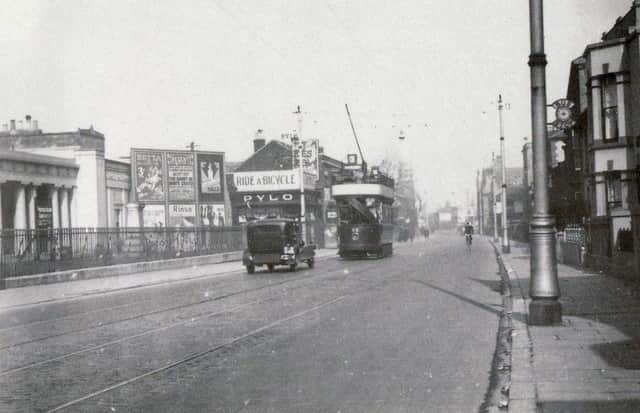 A tram passes Mile End cemetery, Portsmouth, between the wars.