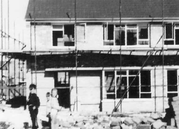 PLAYGROUND ...and not a broken leg in sight. The house in Mitchell Road, Bedhampton, being built in the late 1950s