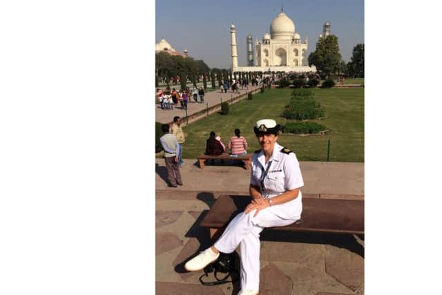 WO1 Lianne Evans, of HMS Defender, recreates a photograph from her father's visit to the Taj Mahal 70 years ago, sitting on the same bench