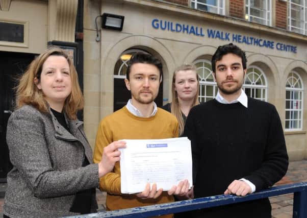 From left, Lalys pharmacy's office manager Kate Harris, manager Ari Loli, counter assistant Sophie Furmedge and dispenser Harry Iliopoulos with the petition 

Picture: Sarah Standing (160330-3409)