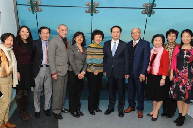(Fourth from right) Albert Choi, chairman of the Portsmouth Chinese Association and (fifth from right) Tan Tianxing, deputy director of the overseas Chinese affairs office, with dignitaries and members of the Portsmouth Chinese Association at the Spinnaker Tower