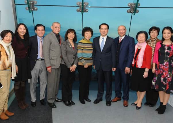 (Fourth from right) Albert Choi, chairman of the Portsmouth Chinese Association and (fifth from right) Tan Tianxing, deputy director of the overseas Chinese affairs office, with dignitaries and members of the Portsmouth Chinese Association at the Spinnaker Tower