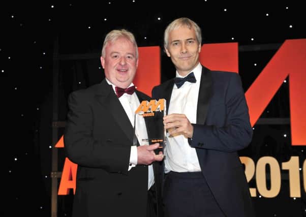 Steve Roberts from Hendy Group receives the award from Robert Hutchinson, Head of Motor Sales from Barclays Partner Finance. PPP-160216-214557001