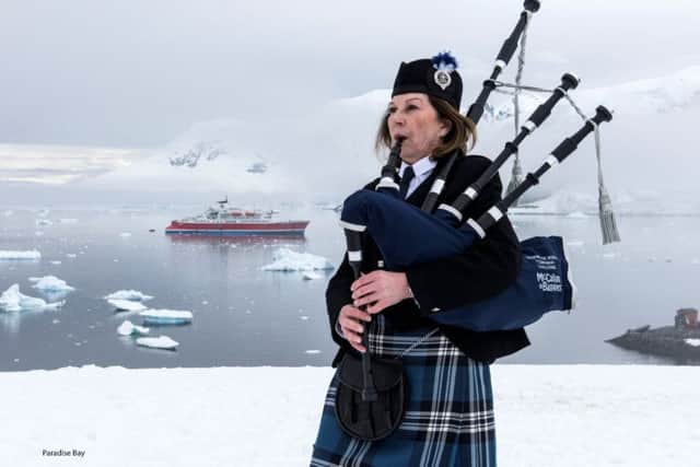 Irene Robinson, a piper who is travelling 50,000 miles to play 12 gigs at famous locations around the world in aid of charity, as she played a unique concert in Paradise Bay, Antarctica.Picture: Renato Granieri/RNRMC/PA Wire