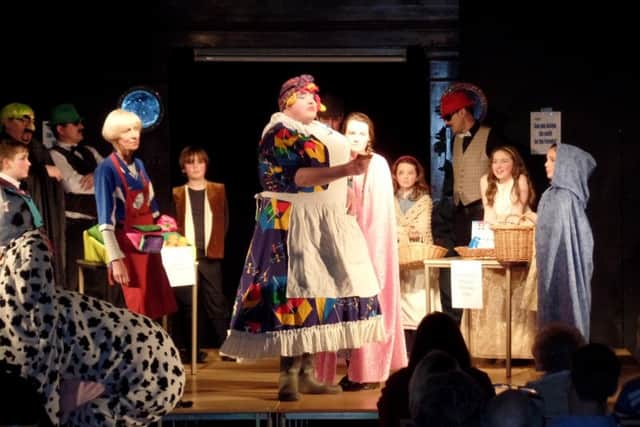 Canon Bob White (centre) as the pantomime dame in St Marys parish panto.