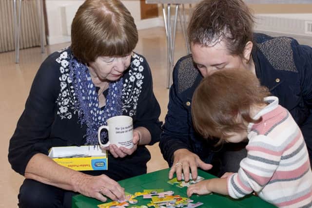 Families enjoy toys and games at the Community Coffee Cup.