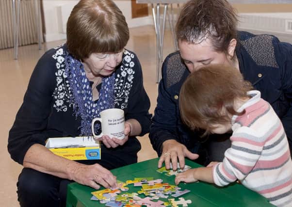 Families enjoy toys and games at the Community Coffee Cup.