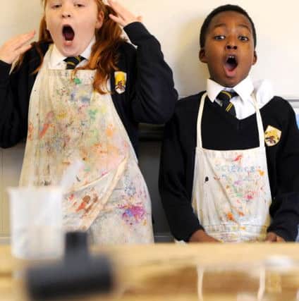 Isla Ransom, nine, and Terry Gapa, 10, during a science lesson in a day of Stem - science, technology, engineering and maths - sessions at Boundary Oak School in Fareham. Old 35mm film cases were filled with water and Alka-Seltzer until they popped and jumped in the air.Picture: Paul Jacobs (160009-2)