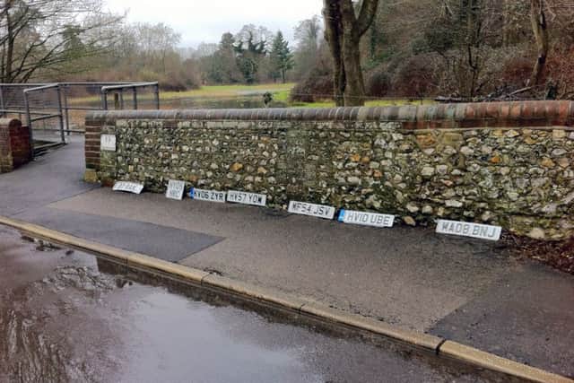Number plates lined up by the ford in Rowlands Castle Picture: Jim Gibson