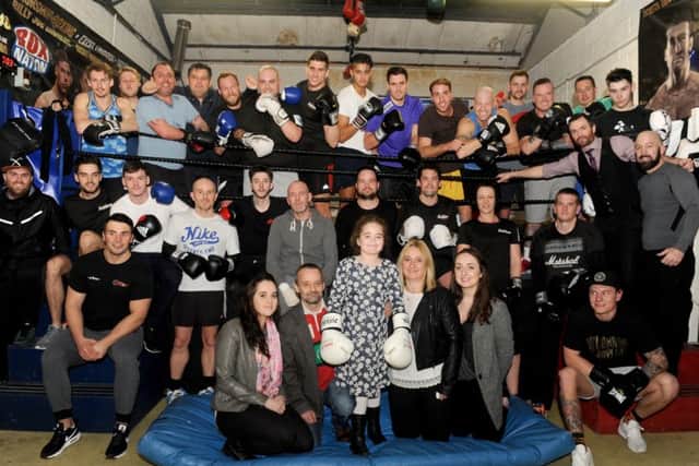 Fundraisers at Bally's Gym in Fratton. Front middle, Maddison Crockford-Reid with her family, from left, half-sister Aimee Bastable, dad Spencer Crockford, mum Shelly Reid and half-sister Jorden Evans  Picture: Sarah Standing (160167-1578)