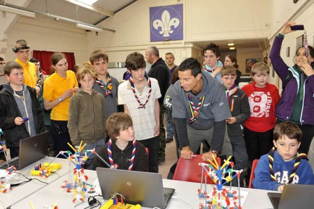 DIGITAL WORLD Bear Grylls meeting scouts at Ferny Crofts Activity Centre working on their technical skills
